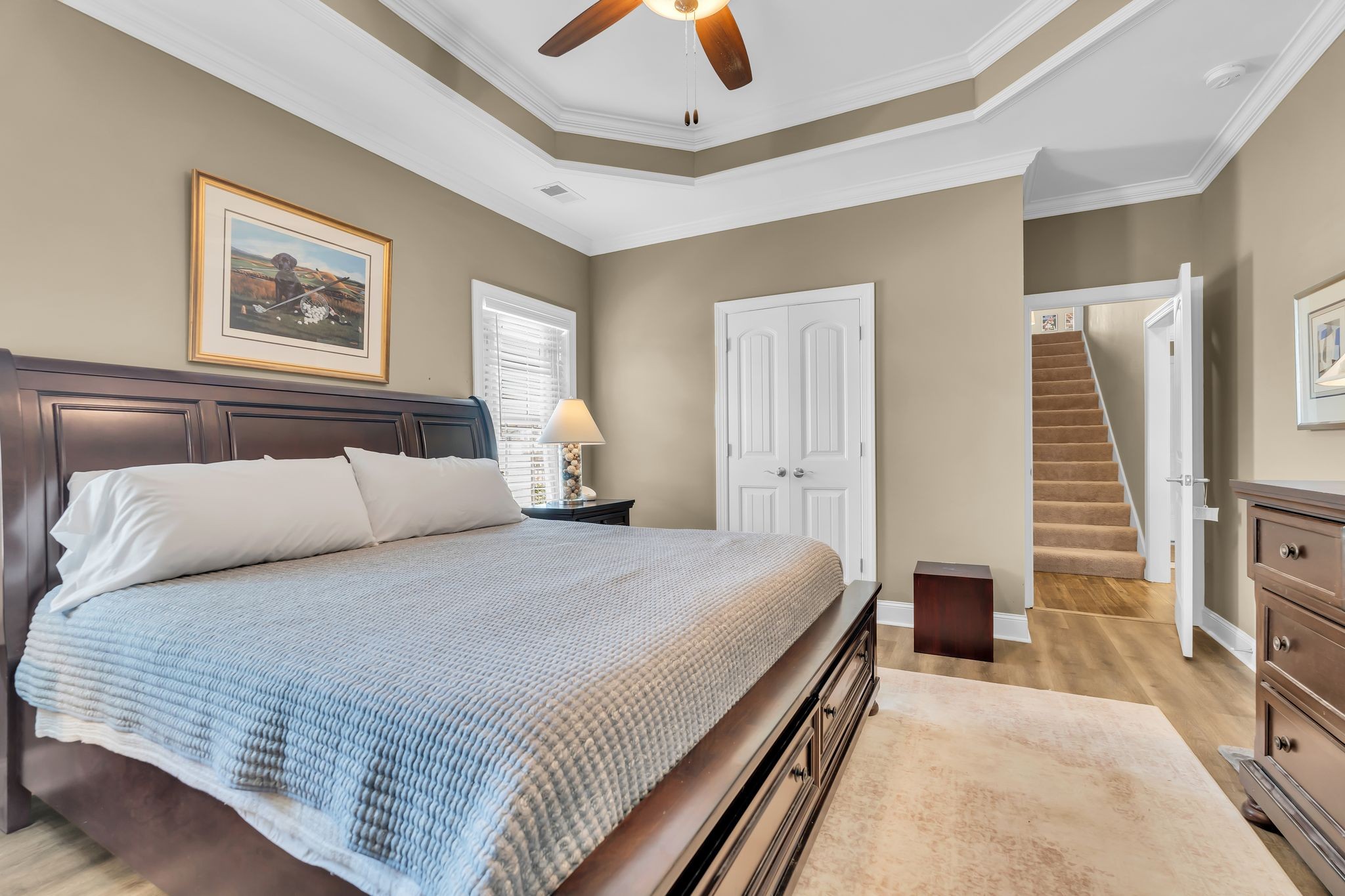 1103 Millstone Creek Road Lascassas, TN 37085 - Photo 14 of 38 a bedroom with a large bed and a chandelier