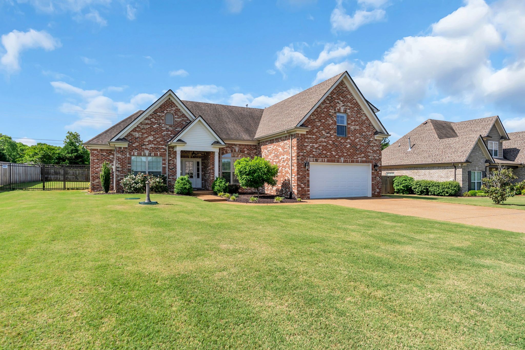 1103 Millstone Creek Road Lascassas, TN 37085 - Photo 2 of 38 a front view of a house with a yard and garage