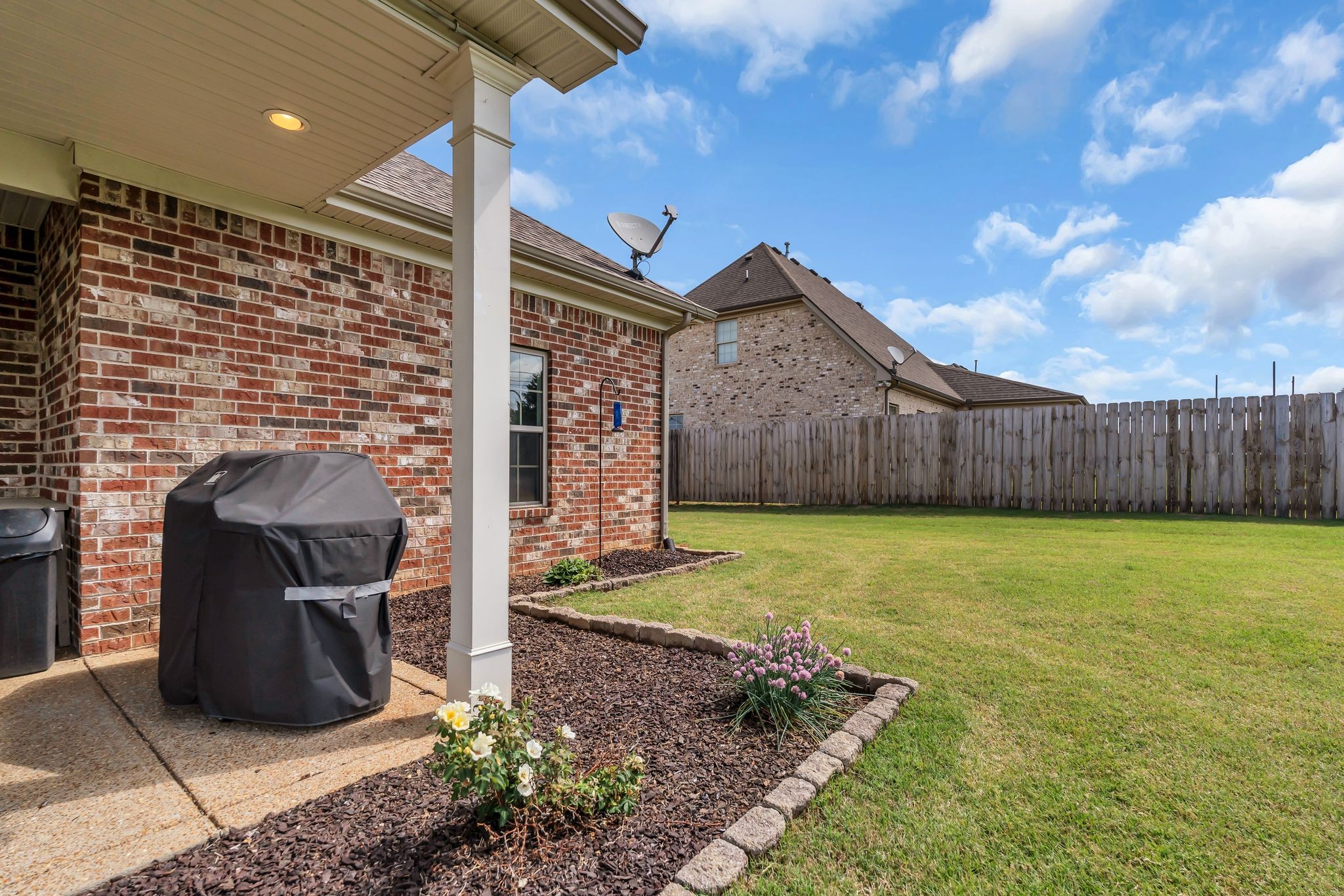 1103 Millstone Creek Road Lascassas, TN 37085 - Photo 28 of 38 a view of a backyard with table and chairs with wooden fence