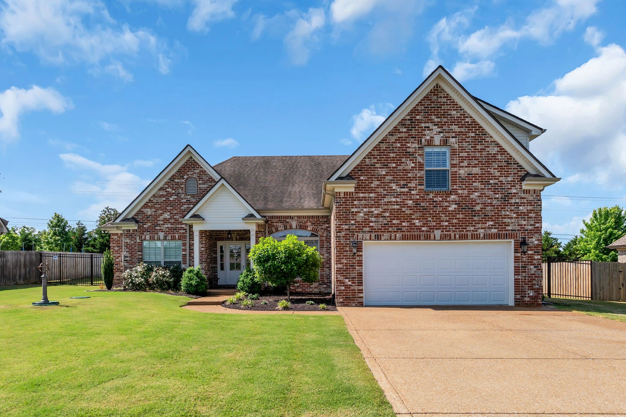 1103 Millstone Creek Road Lascassas, TN 37085 - Photo 37 of 38 a front view of a house with a yard and garage