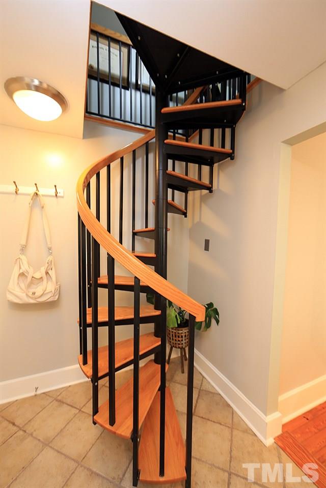 1530 Carson Street Raleigh, NC 27608 - Photo 8 of 21 The spiral staircase is located off the kitchen.