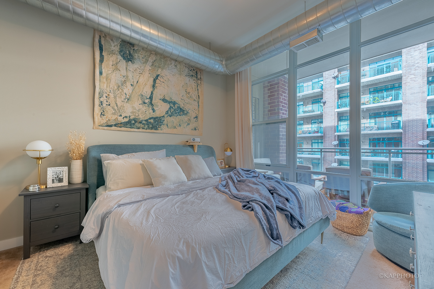 901 West Madison Street, Unit 512 Chicago, IL 60607 - Photo 19 of 36 a bed sitting in a bedroom next to a large window