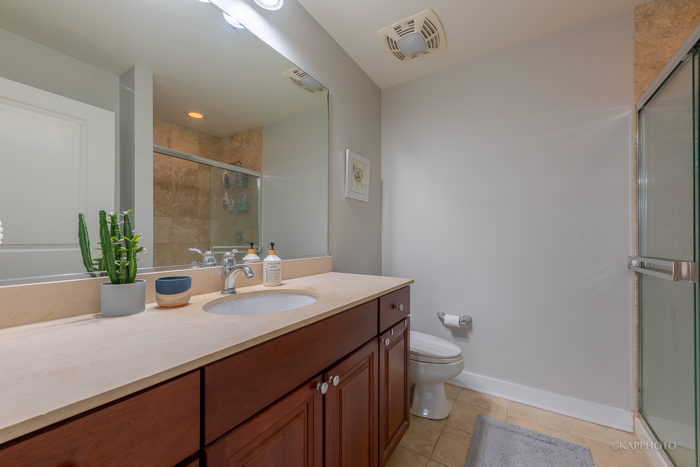 901 West Madison Street, Unit 512 Chicago, IL 60607 - Photo 21 of 36 a bathroom with a sink a toilet and a mirror