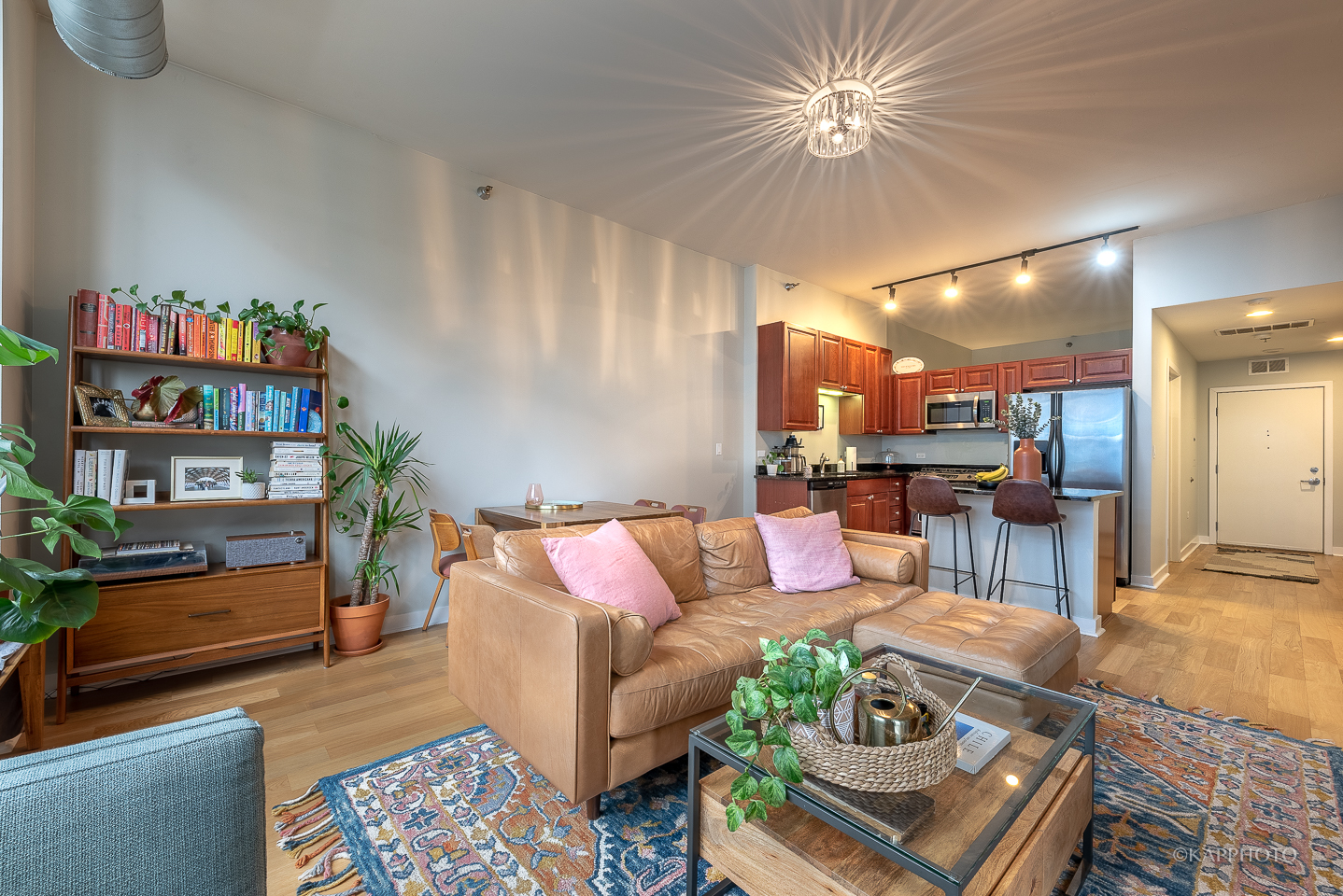 901 West Madison Street, Unit 512 Chicago, IL 60607 - Photo 10 of 36 a living room with furniture and a dining table with kitchen view