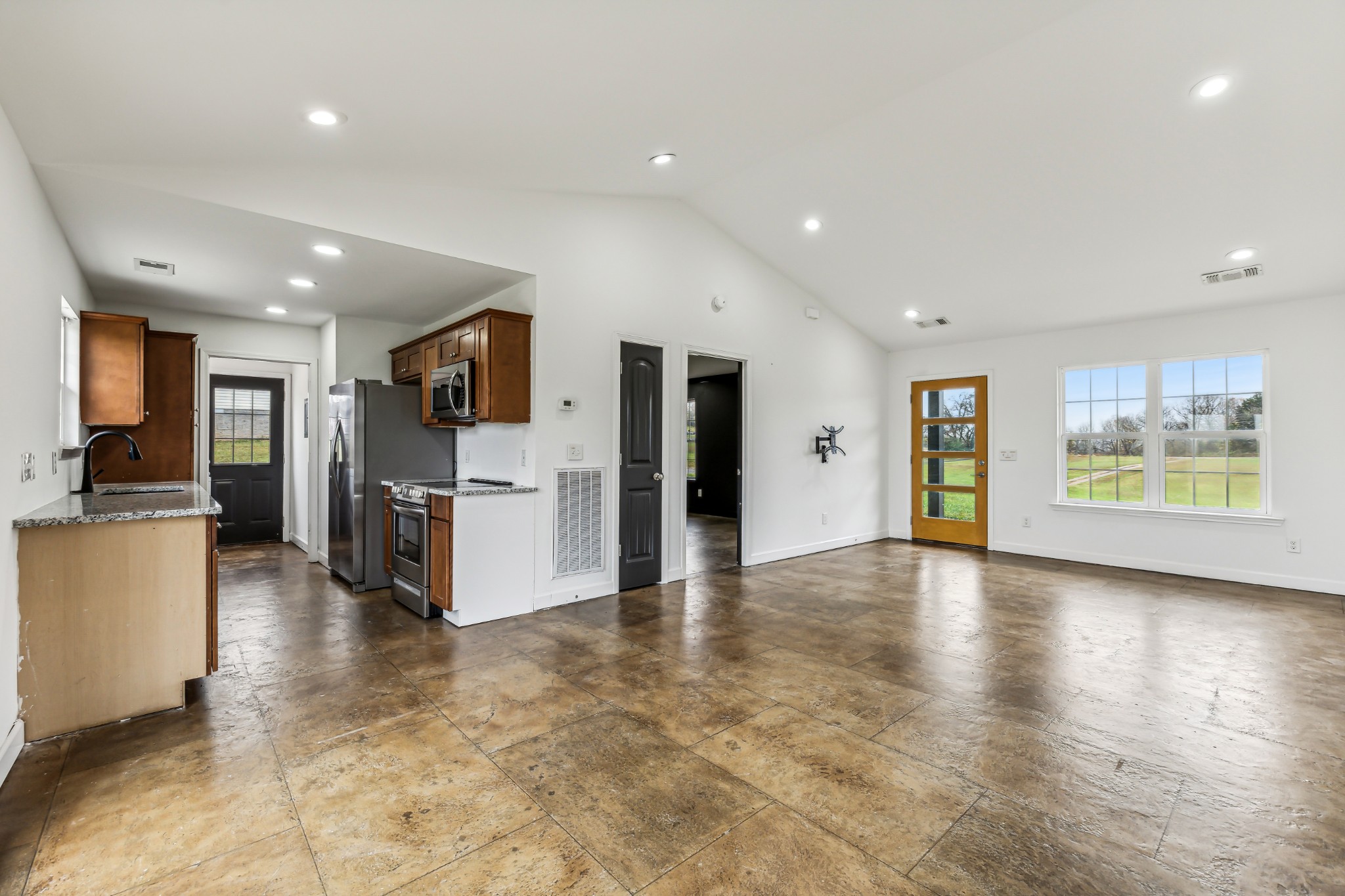 3772 Beasleys Bend Road Lebanon, TN 37087 - Photo 7 of 25 a view of a kitchen with refrigerator and a stove top oven