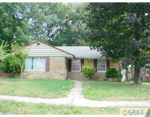 7 Melville Road Edison, NJ 08817 - Photo 1 of 1 a front view of a house with a yard