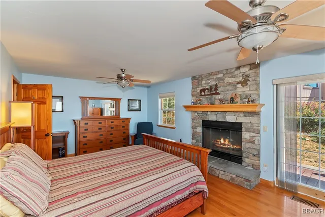 a bedroom with a bed and a fireplace