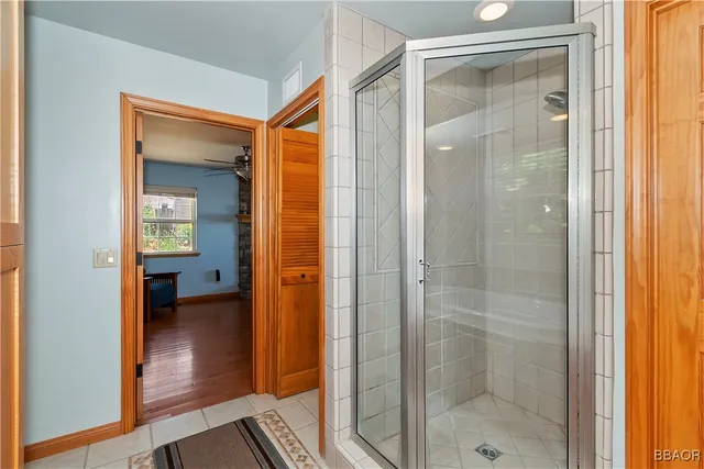 a bathroom with a glass shower door