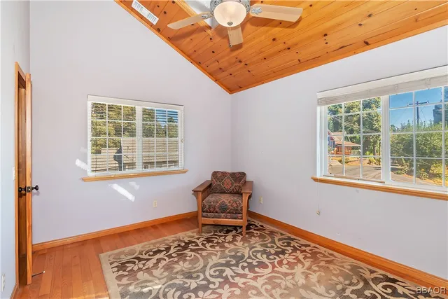 a bench sitting in a bedroom next to a window