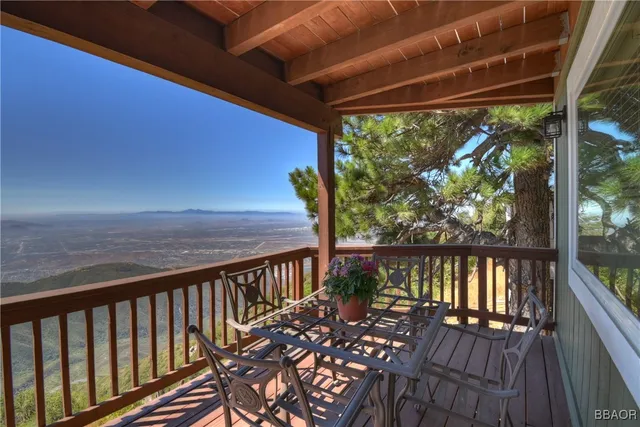 a view of a balcony with wooden floor