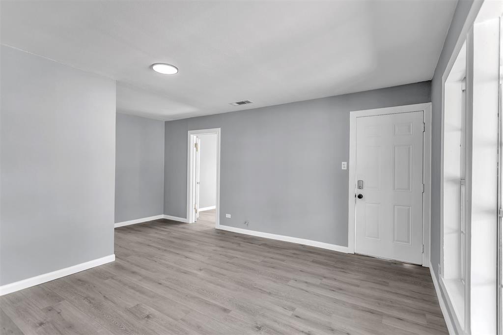 904 North Virginia Street Terrell, TX 75160 - Photo 2 of 22 a view of an empty room with wooden floor
