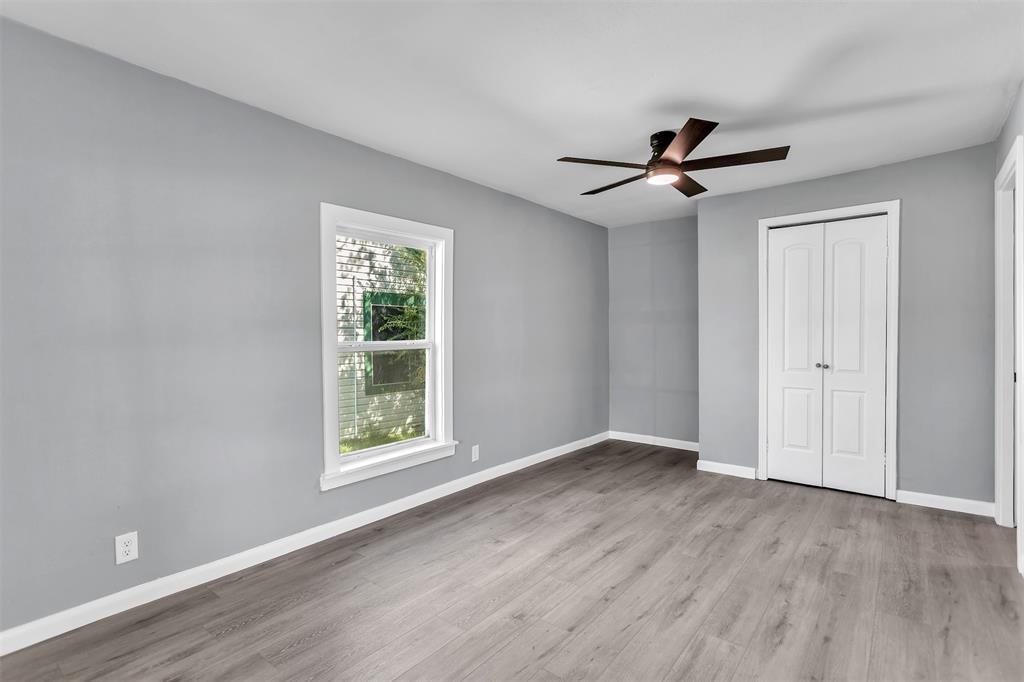 904 North Virginia Street Terrell, TX 75160 - Photo 8 of 22 a view of an empty room with a window and wooden floor