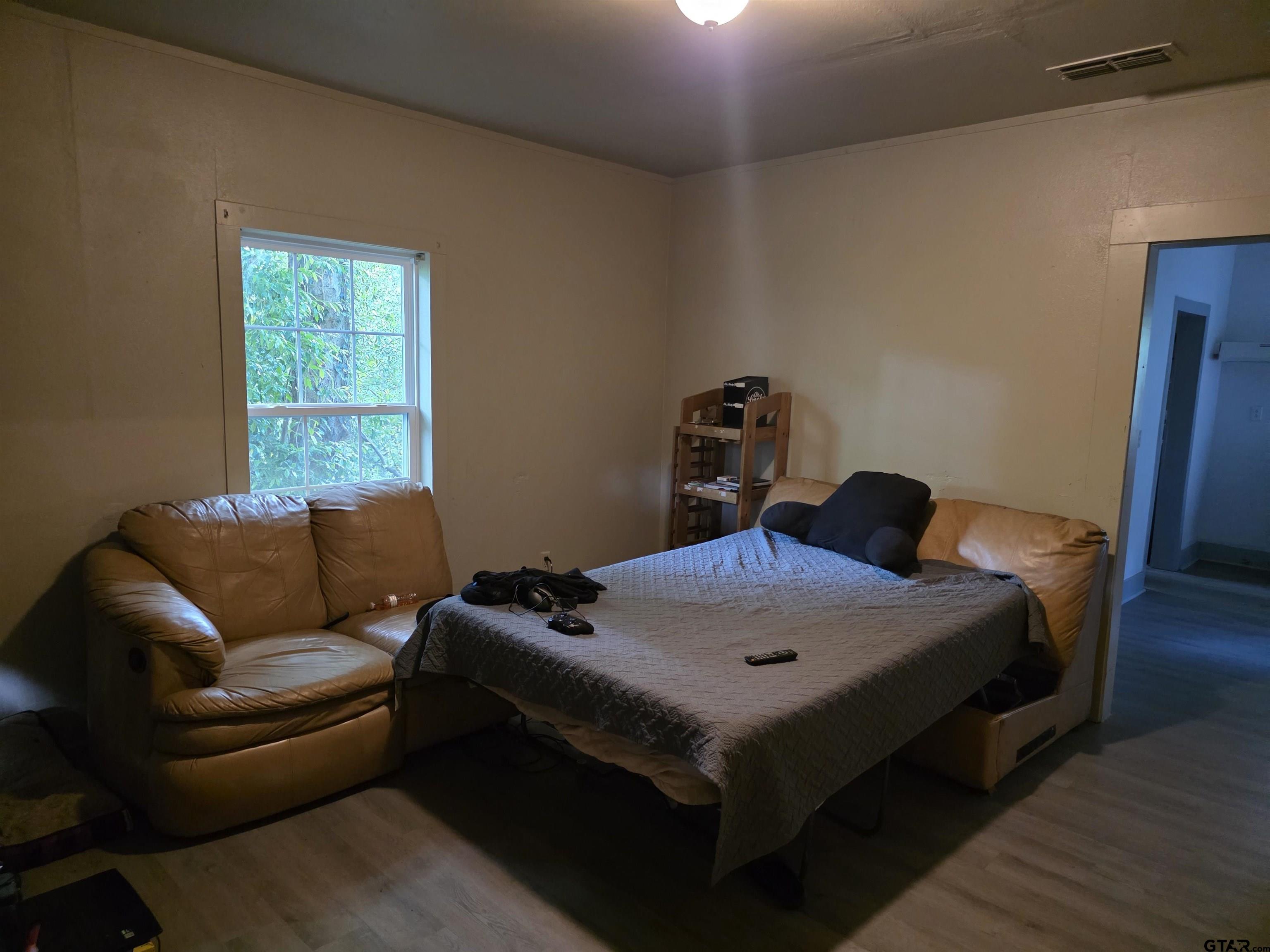 316 North Hospital Street Rusk, TX 75785 - Photo 10 of 21 a bed room with furniture and a window