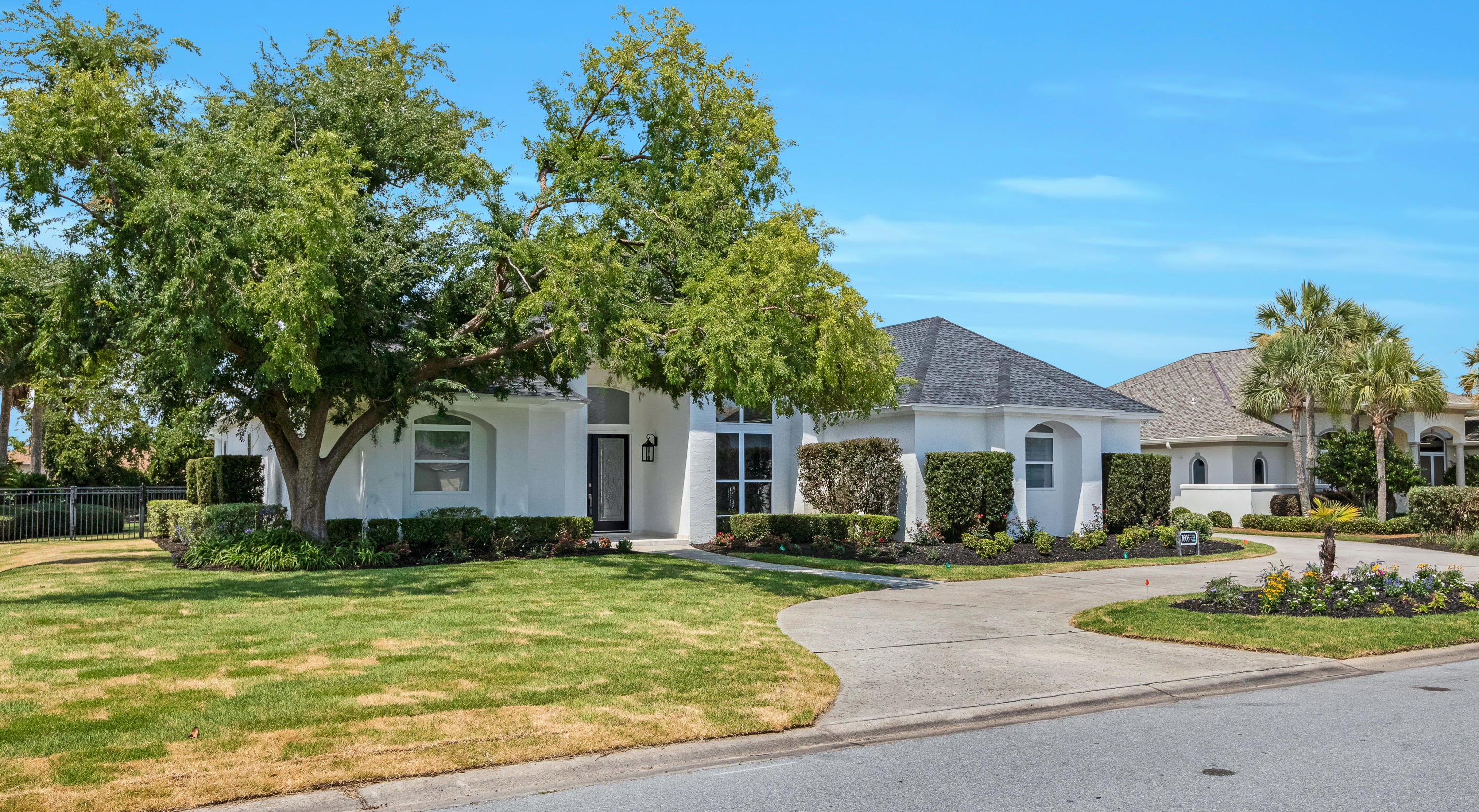 3606 Dragon's Ridge Road Panama City Beach, FL 32408 - Photo 2 of 49 a front view of a house with a yard