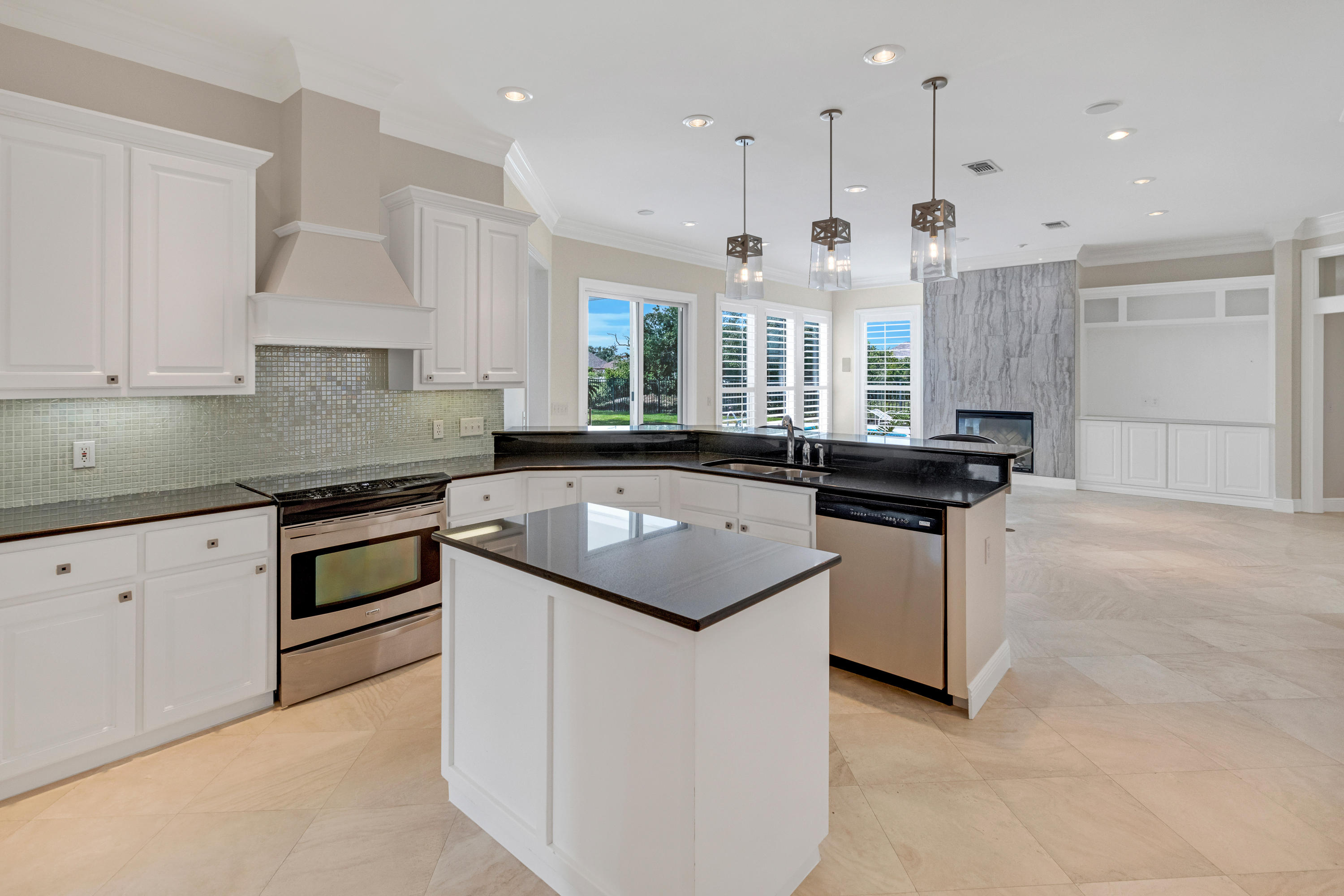 3606 Dragon's Ridge Road Panama City Beach, FL 32408 - Photo 13 of 49 a kitchen with a sink stove and cabinets