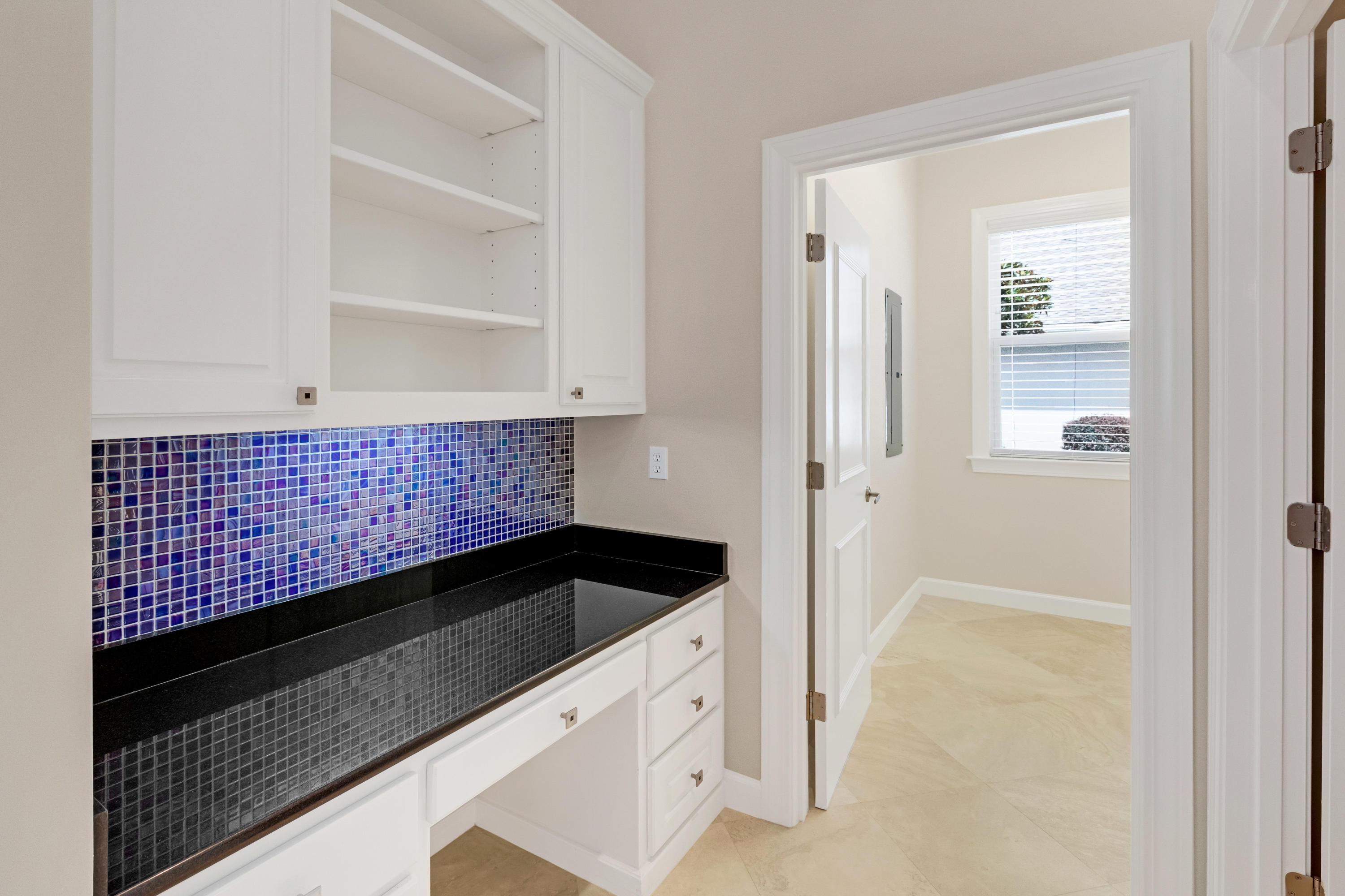 3606 Dragon's Ridge Road Panama City Beach, FL 32408 - Photo 15 of 49 a kitchen with a sink and cabinets
