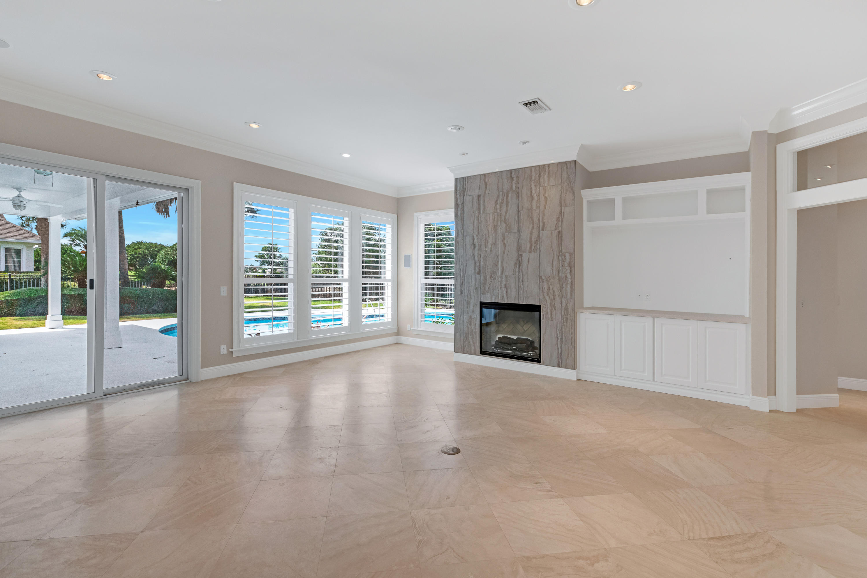 3606 Dragon's Ridge Road Panama City Beach, FL 32408 - Photo 17 of 49 a view of an empty room with a fireplace and a window