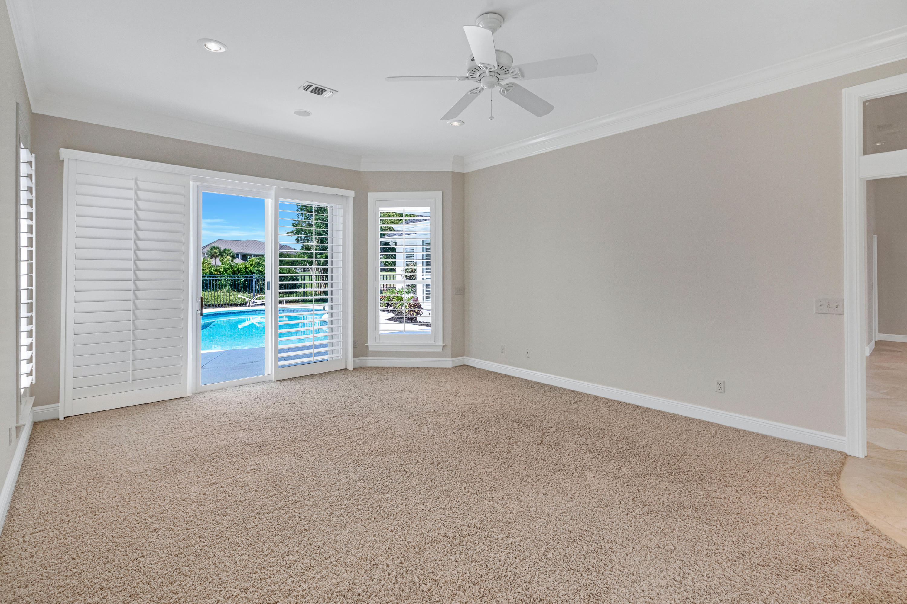 3606 Dragon's Ridge Road Panama City Beach, FL 32408 - Photo 21 of 49 a view of a livingroom with a ceiling fan and window