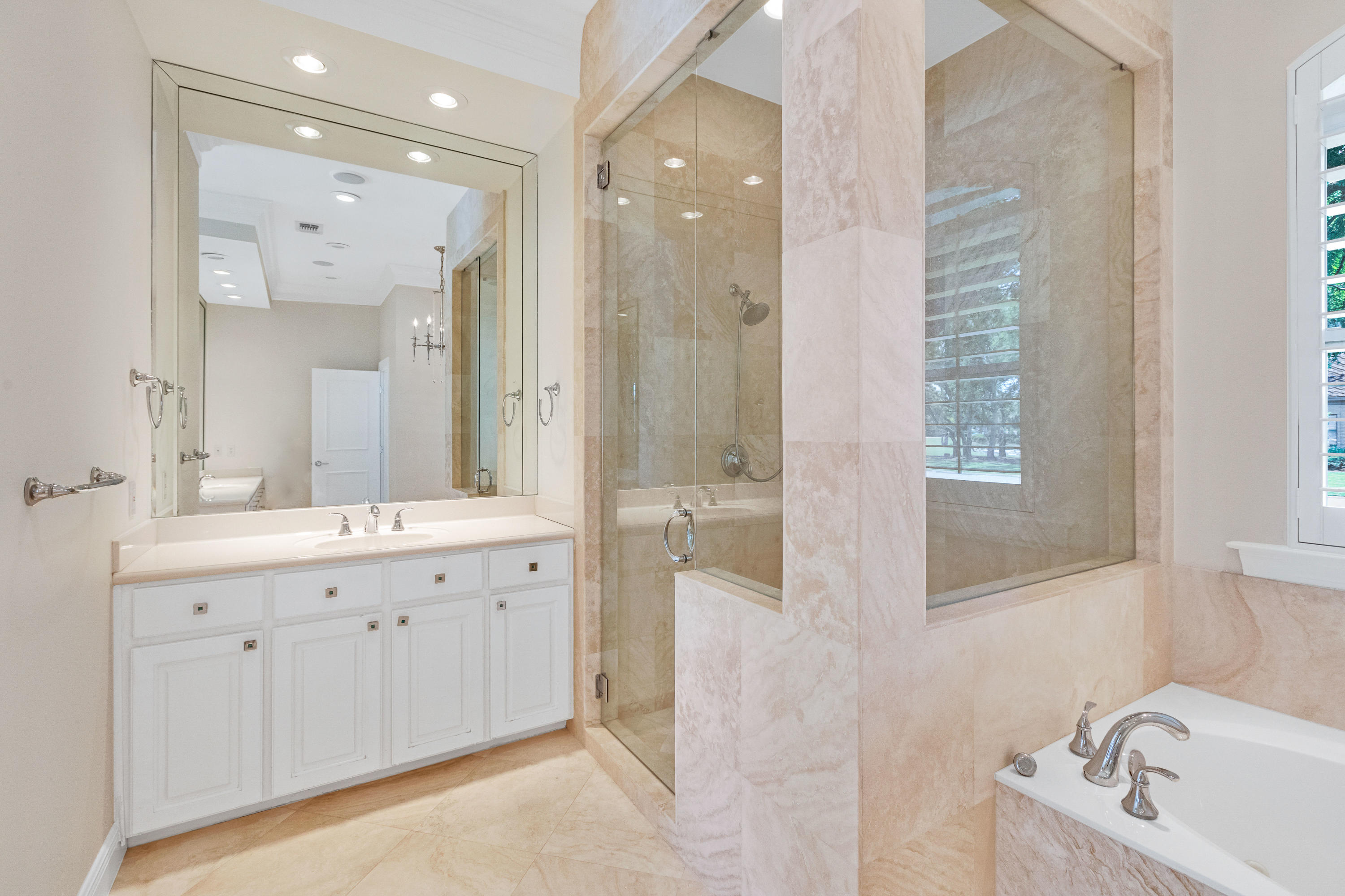 3606 Dragon's Ridge Road Panama City Beach, FL 32408 - Photo 24 of 49 a bathroom with a double vanity sink mirror and bathtub