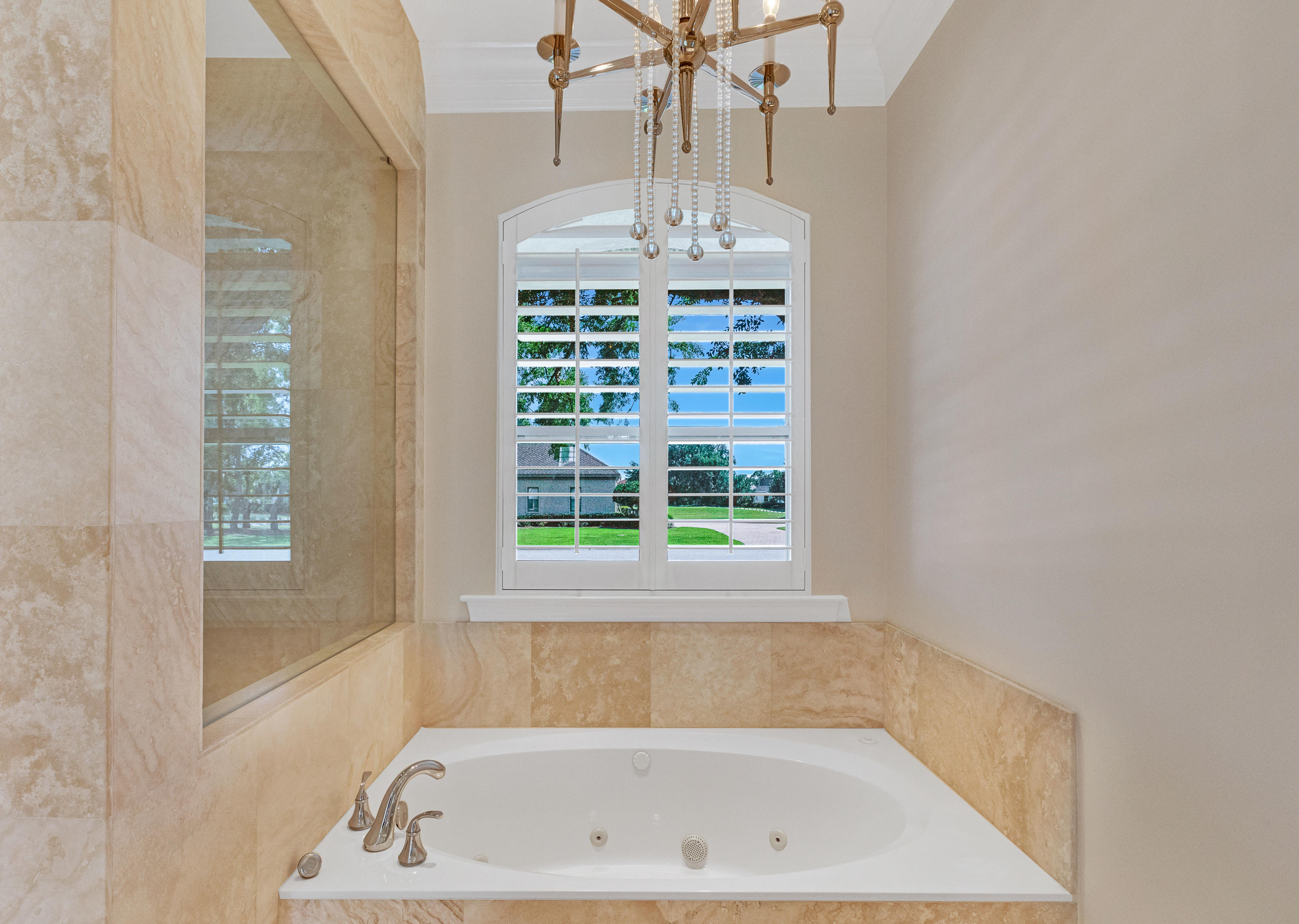 3606 Dragon's Ridge Road Panama City Beach, FL 32408 - Photo 27 of 49 a bath tub sitting in a bathroom next to a window