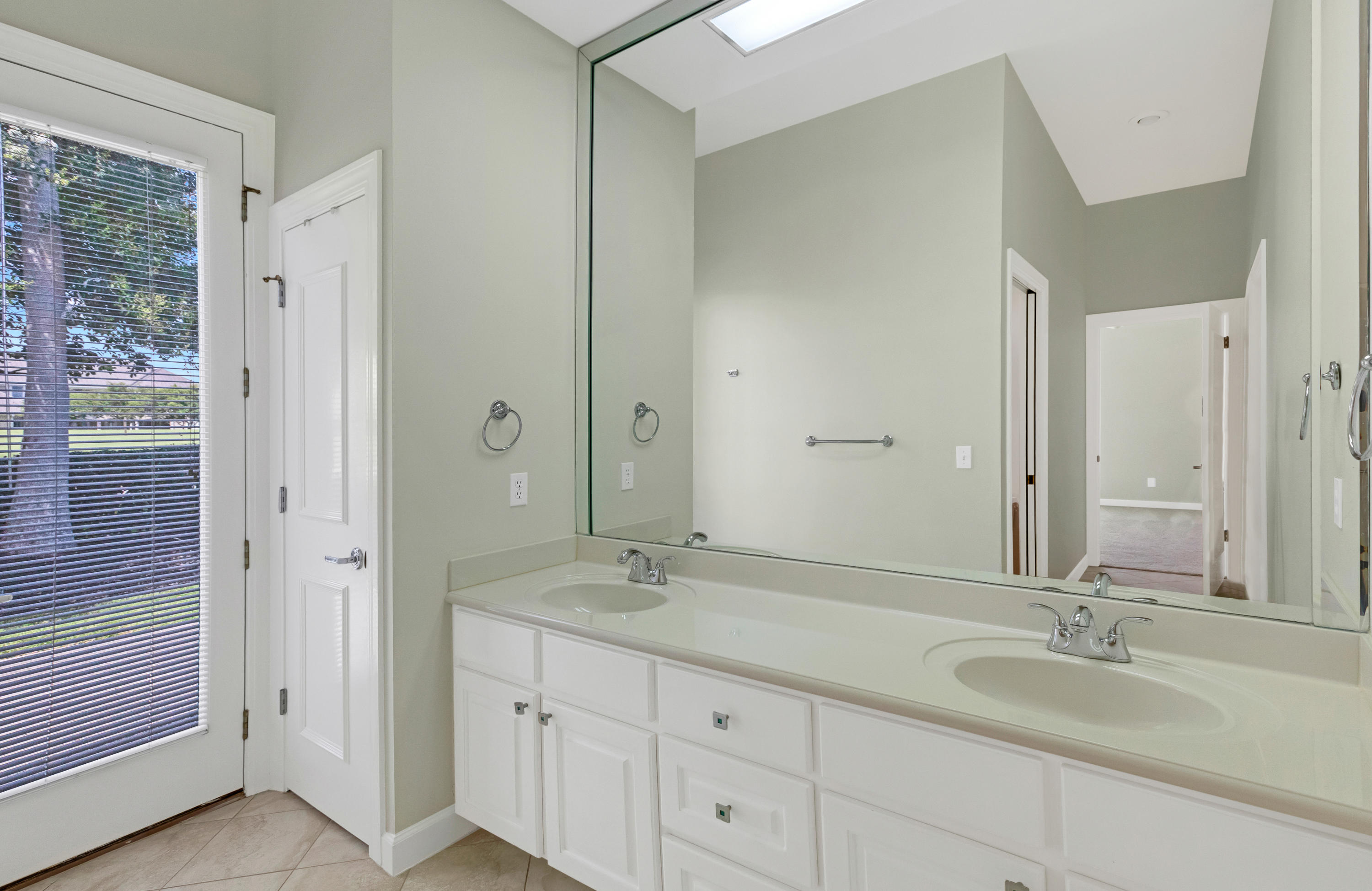 3606 Dragon's Ridge Road Panama City Beach, FL 32408 - Photo 36 of 49 a bathroom with double sink and a mirror