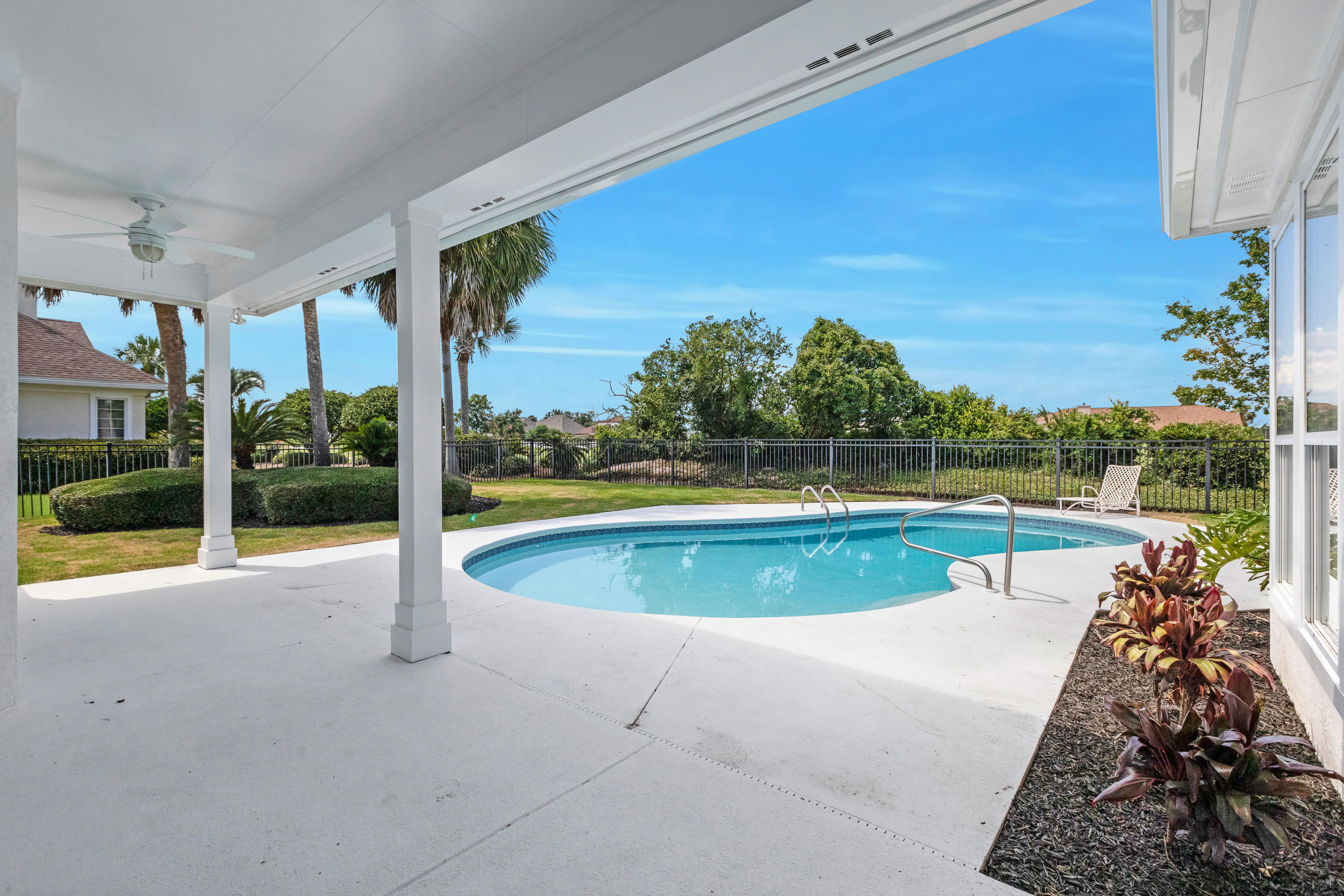 3606 Dragon's Ridge Road Panama City Beach, FL 32408 - Photo 40 of 49 a view of a swimming pool with a patio and a backyard