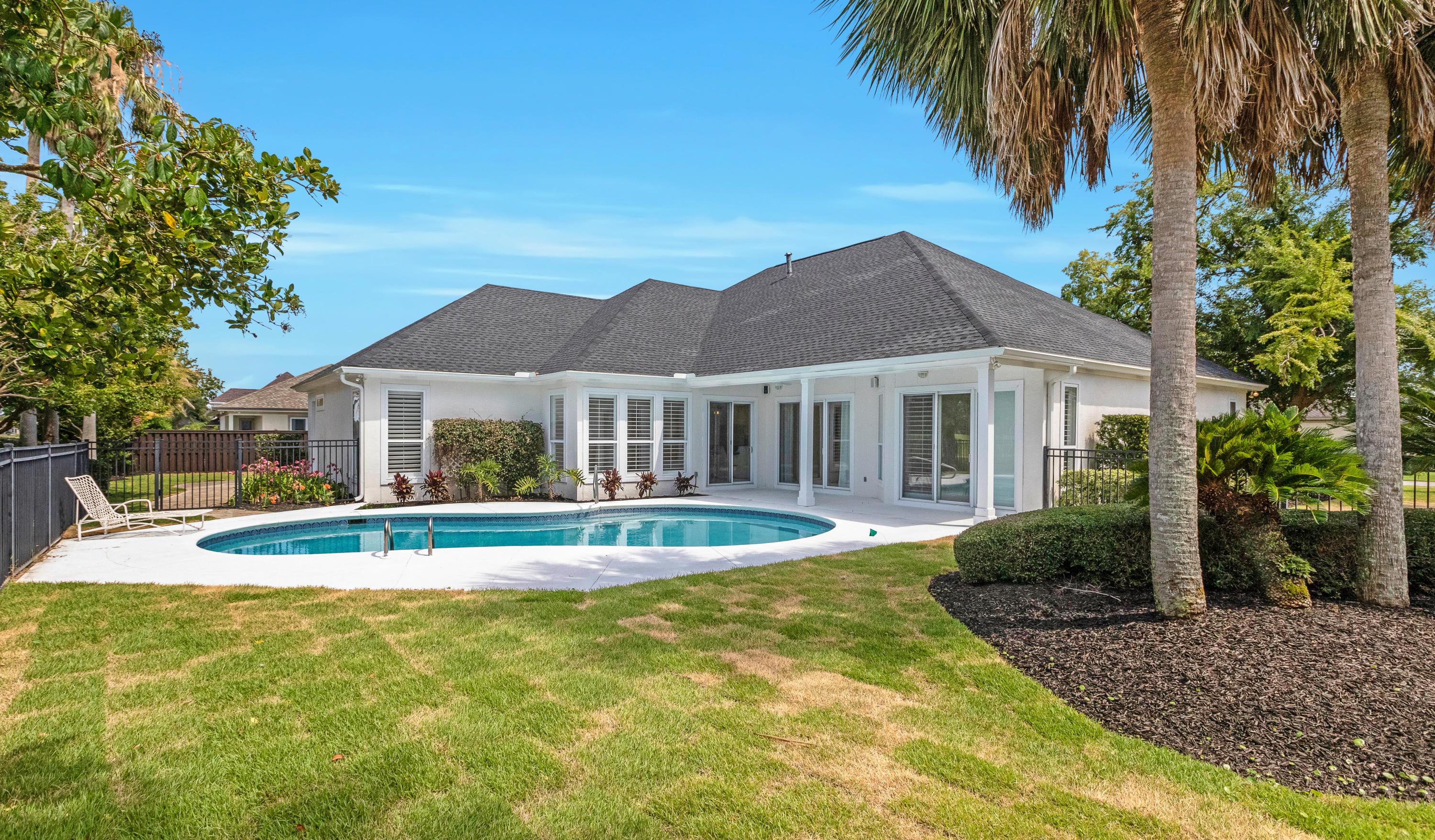 3606 Dragon's Ridge Road Panama City Beach, FL 32408 - Photo 5 of 49 a front view of a house with a yard