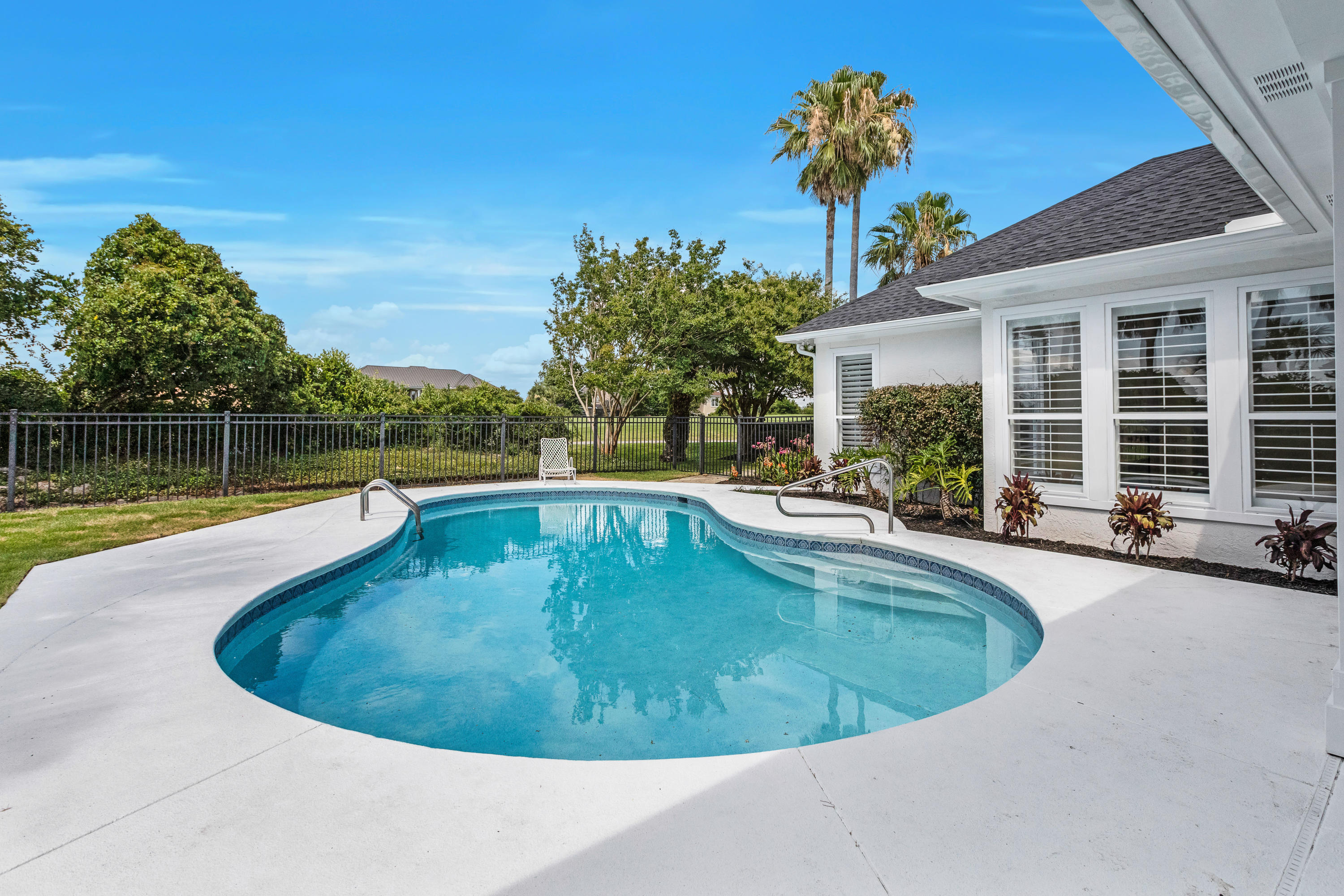 3606 Dragon's Ridge Road Panama City Beach, FL 32408 - Photo 41 of 49 a view of a swimming pool with a lounge chair
