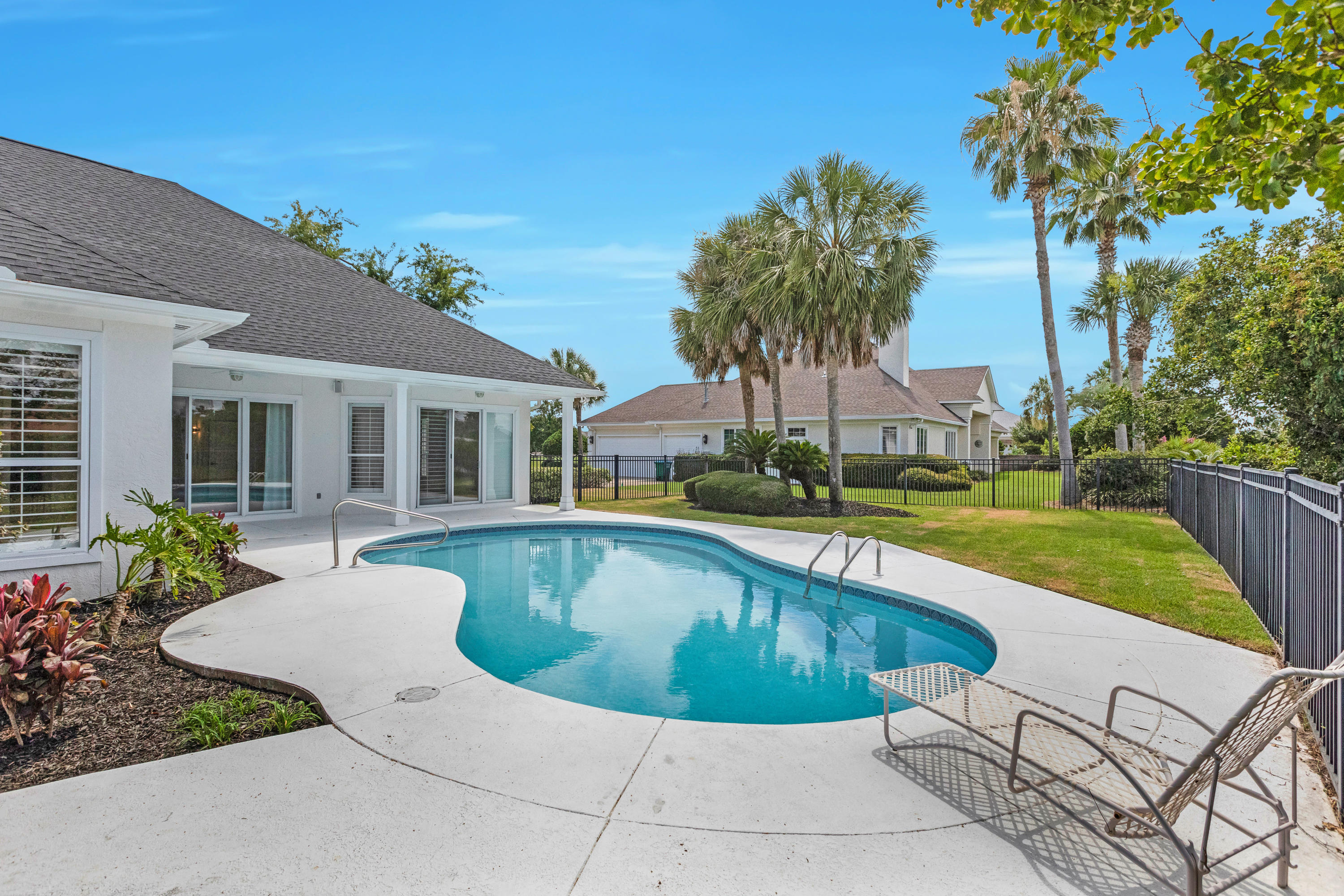 3606 Dragon's Ridge Road Panama City Beach, FL 32408 - Photo 43 of 49 a view of a house with swimming pool and sitting area