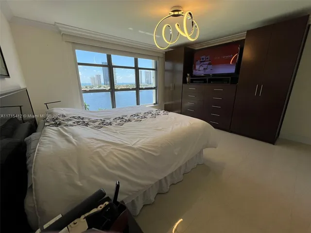a bedroom with a bed and a window in it
