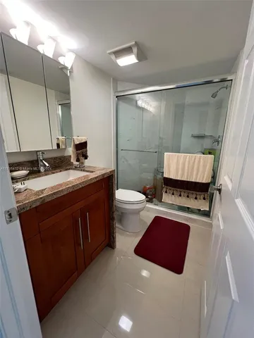 a utility room with dryer washer and a view of living room