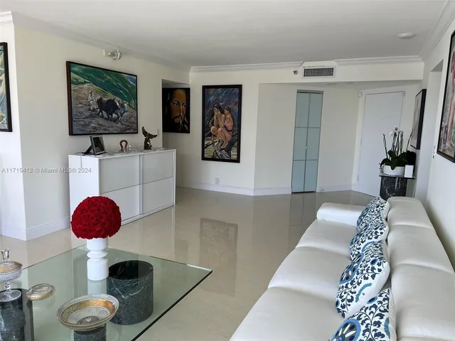 a view of a livingroom with furniture and wooden floor