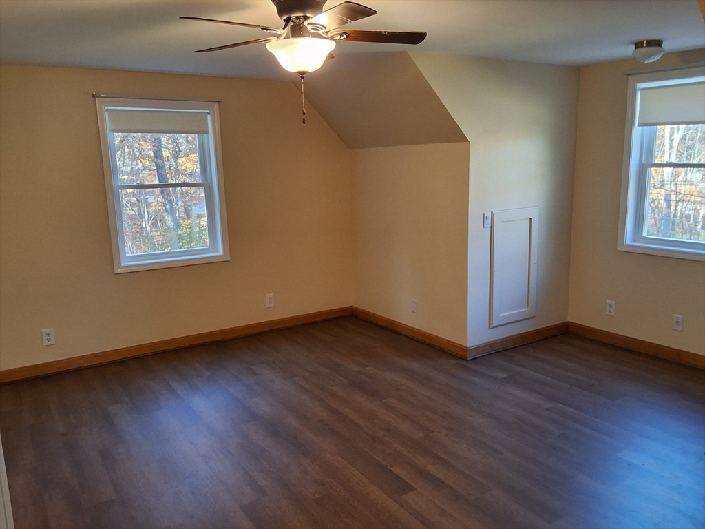 103 Barre Road Oakham, MA 01068 - Photo 24 of 26 a view of an empty room with wooden floor and a window