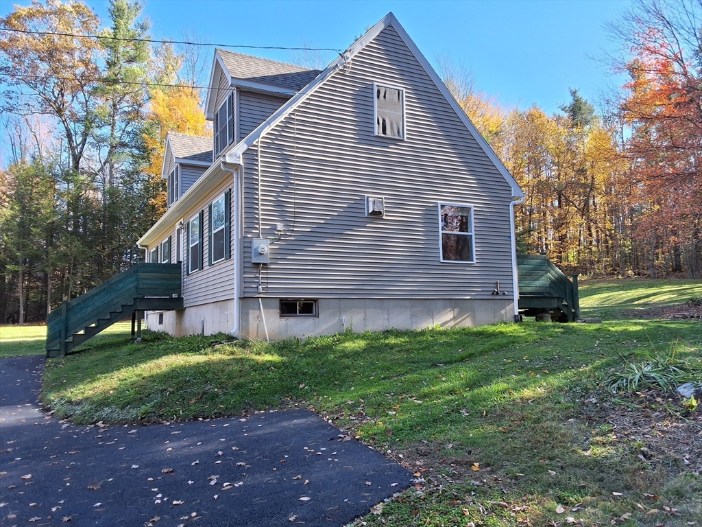 103 Barre Road Oakham, MA 01068 - Photo 3 of 26 a view of a house with a yard