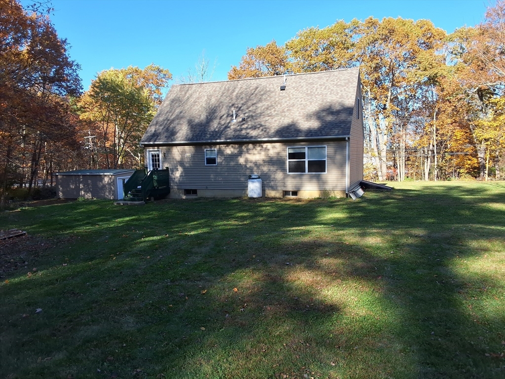 103 Barre Road Oakham, MA 01068 - Photo 6 of 26 a front view of a house with a yard