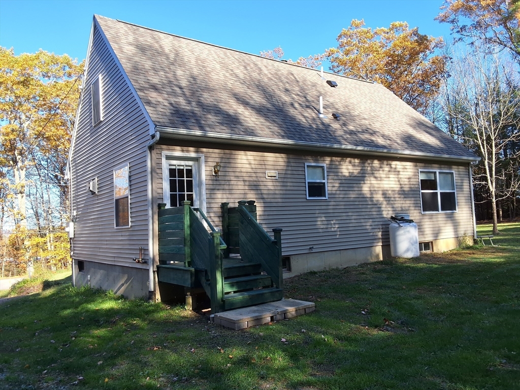 103 Barre Road Oakham, MA 01068 - Photo 7 of 26 a view of backyard with a garden and plants