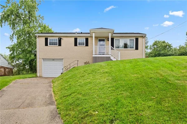 a house view with a garden space
