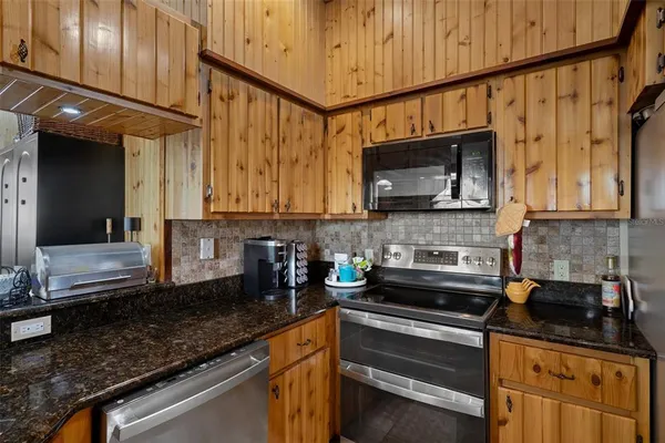 a kitchen with granite countertop lots of counter top space