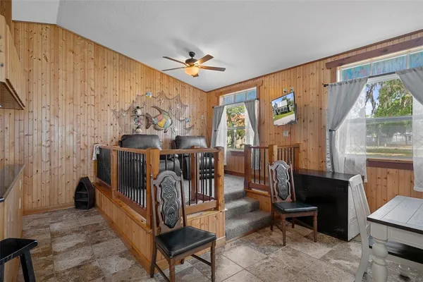a bedroom with furniture and a window