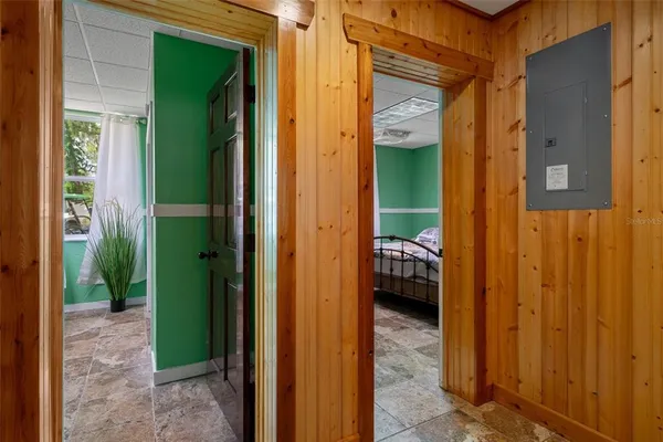 a bedroom with a bed with green walls