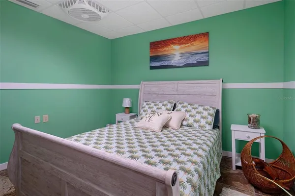 a bedroom with a bed and large cabinets