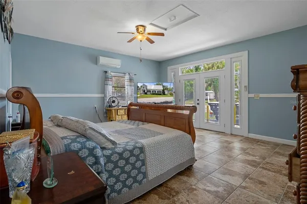 a bathroom with a granite countertop sink toilet mirror vanity and shower