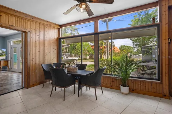 a dining room with furniture a chandelier and a rug