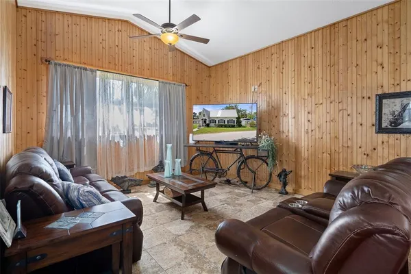a living room with furniture and a window