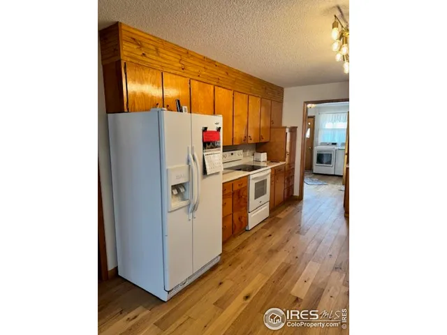a kitchen with stainless steel appliances a stove and a refrigerator