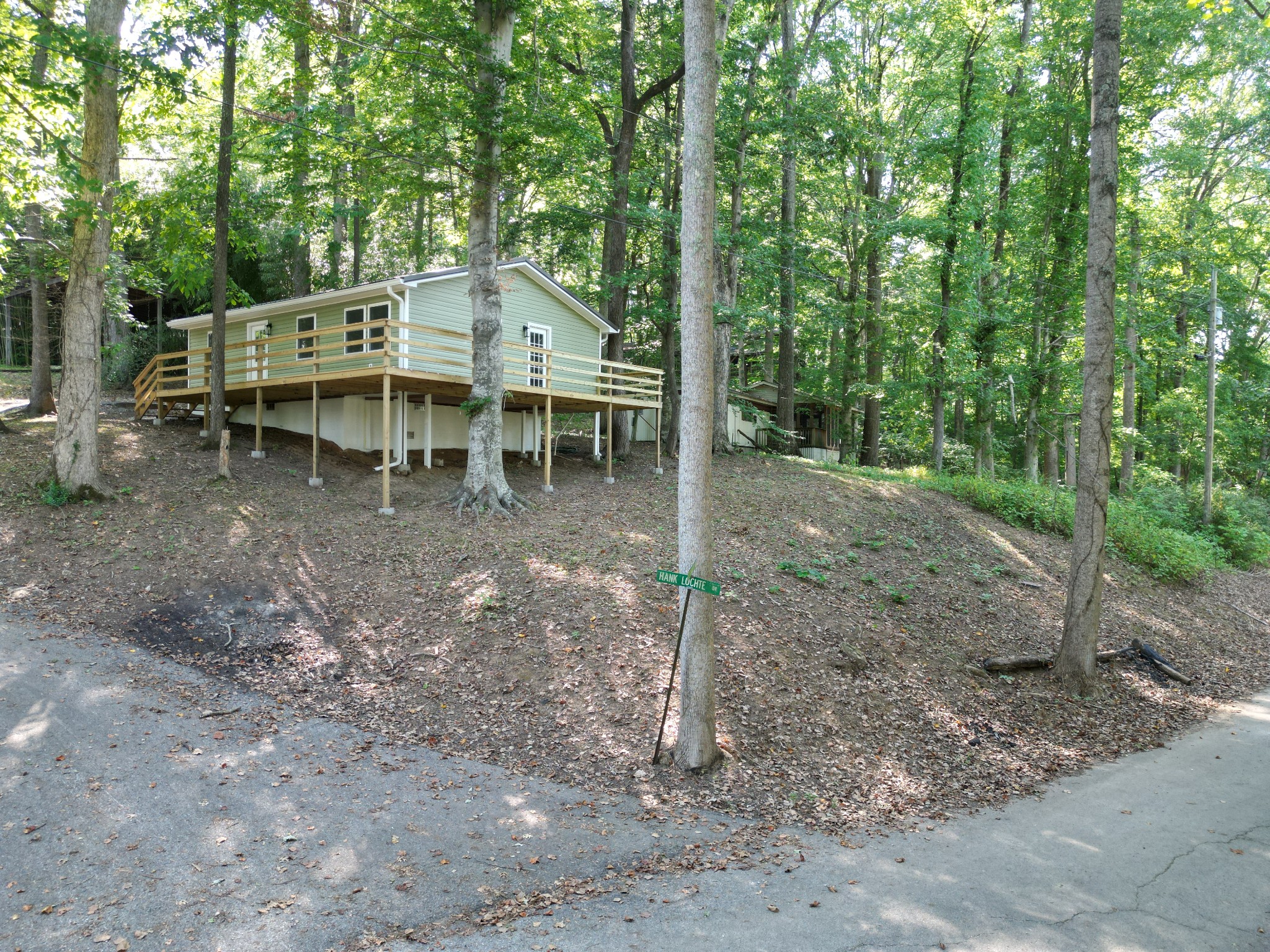 159 Hanklochte Drive Decaturville, TN 38329 - Photo 30 of 39 a view of a house with a yard and hanging chair
