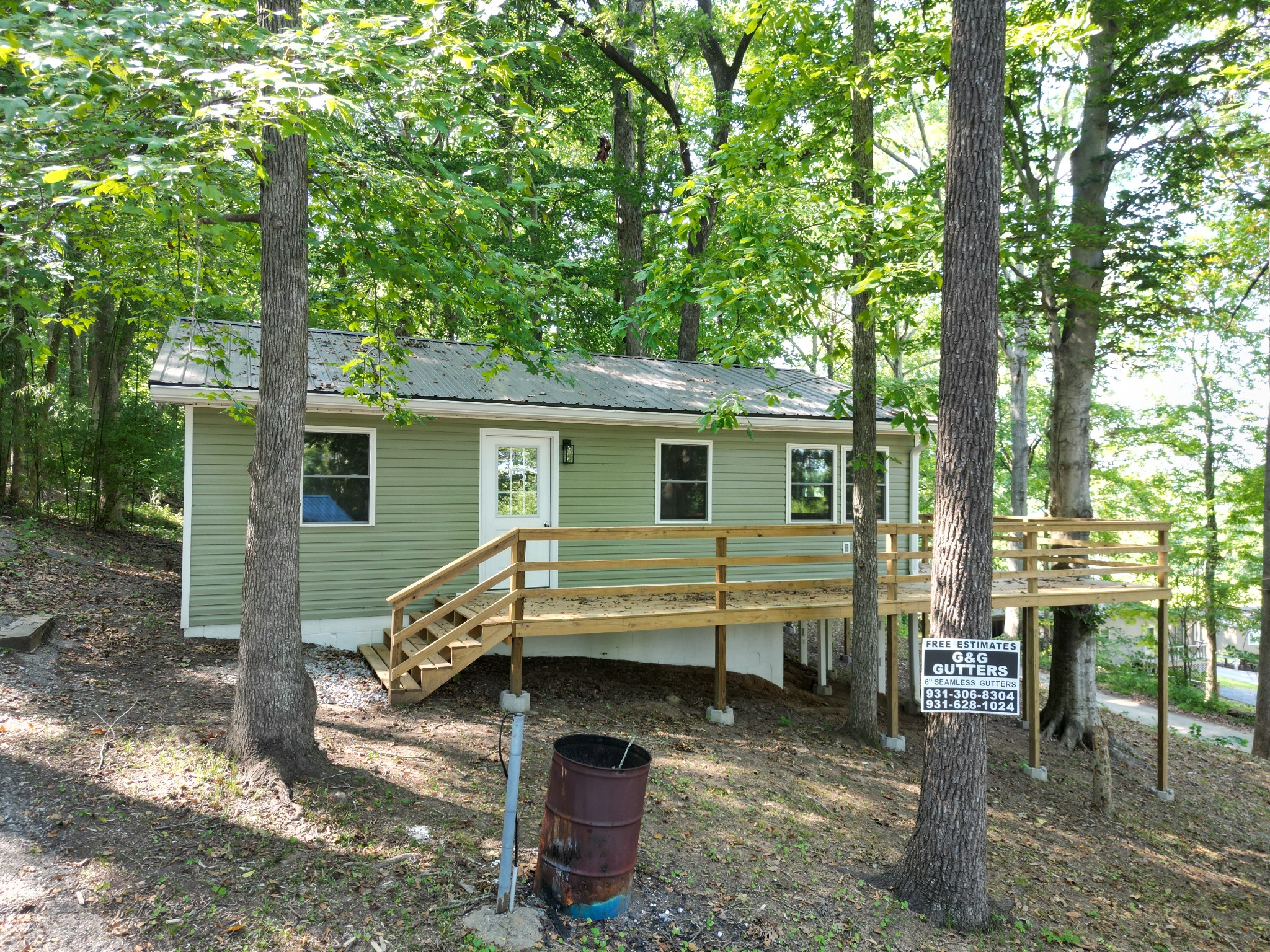 159 Hanklochte Drive Decaturville, TN 38329 - Photo 3 of 39 a view of house with backyard outdoor seating and green space