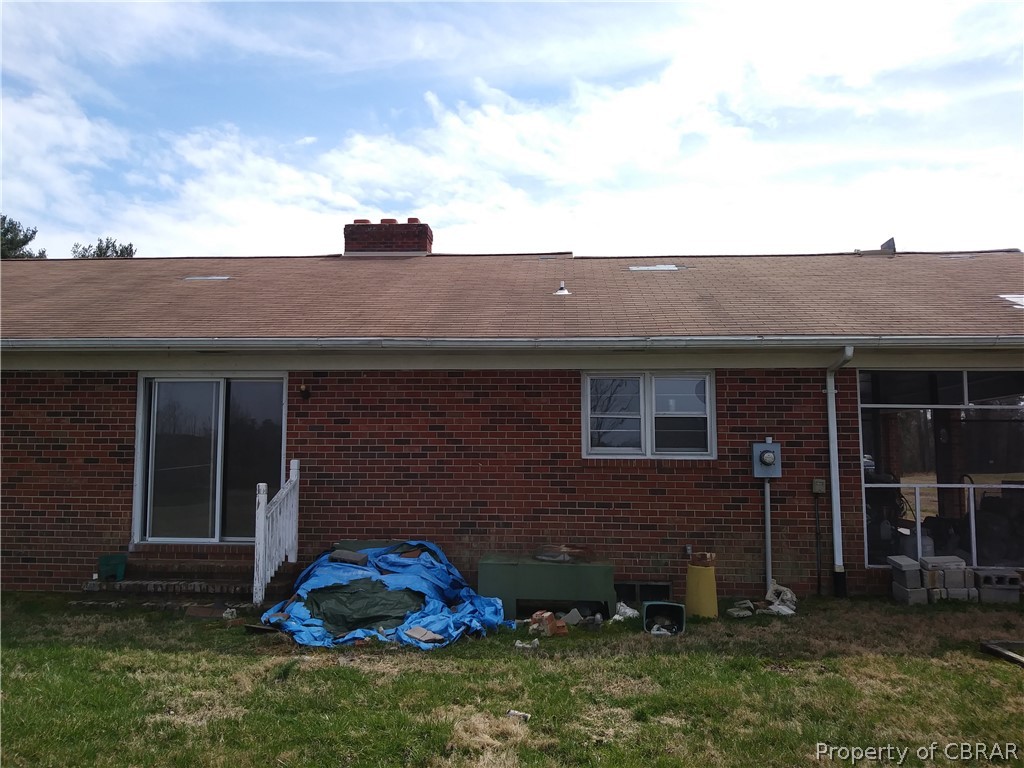 1498 Sharps Road Warsaw, VA 22572 - Photo 8 of 21 a front view of a house with a yard