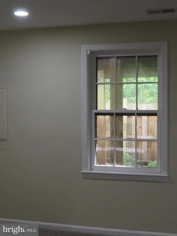 a view of a room with a large window