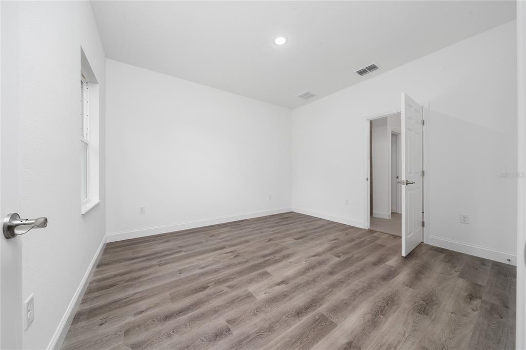 8922 Southwest 135th Street Road Ocala, FL 34473 - Photo 14 of 44 wooden floor in a room